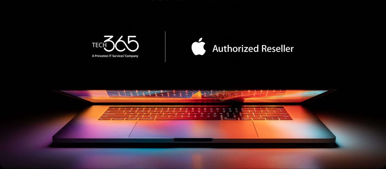 Apple laptop on workspace table